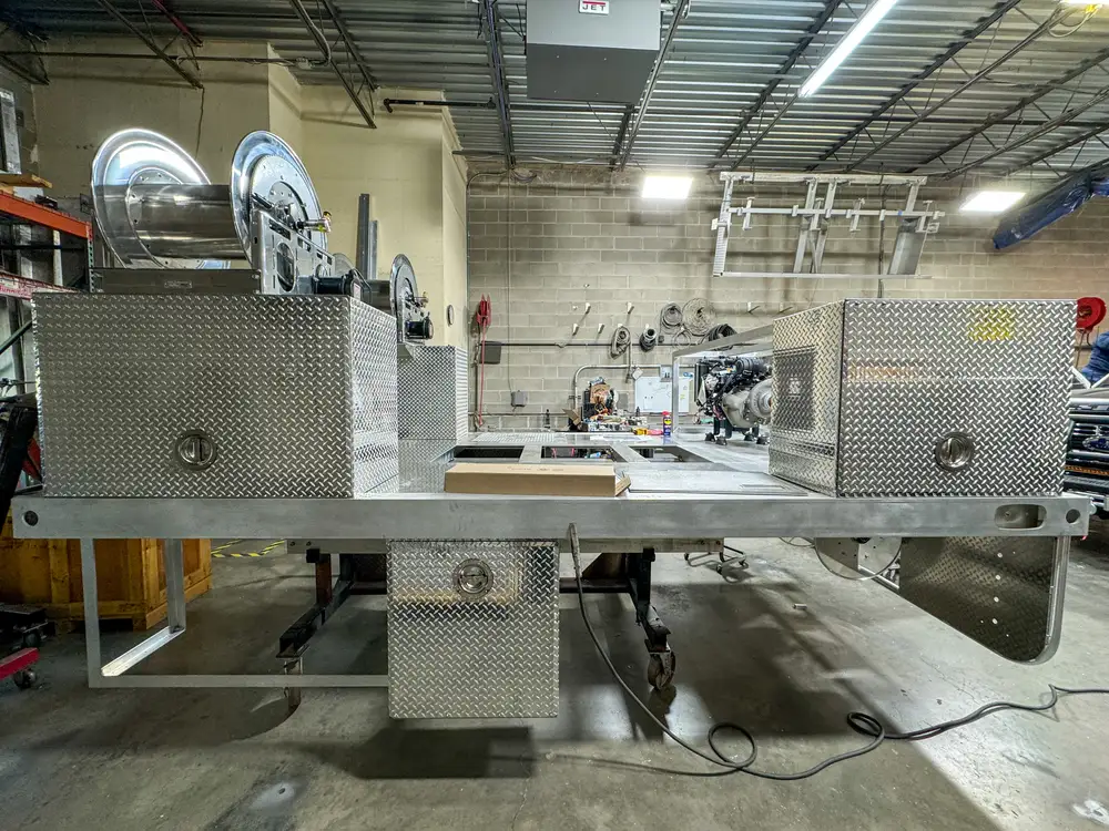 Apparatus in production bay with hood open, photo 181 of 303.